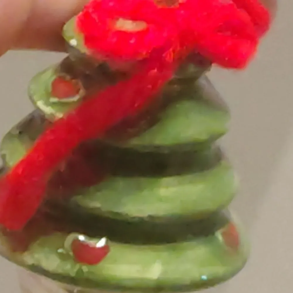 Festive Green Christmas Tree Ornament with Red Accents